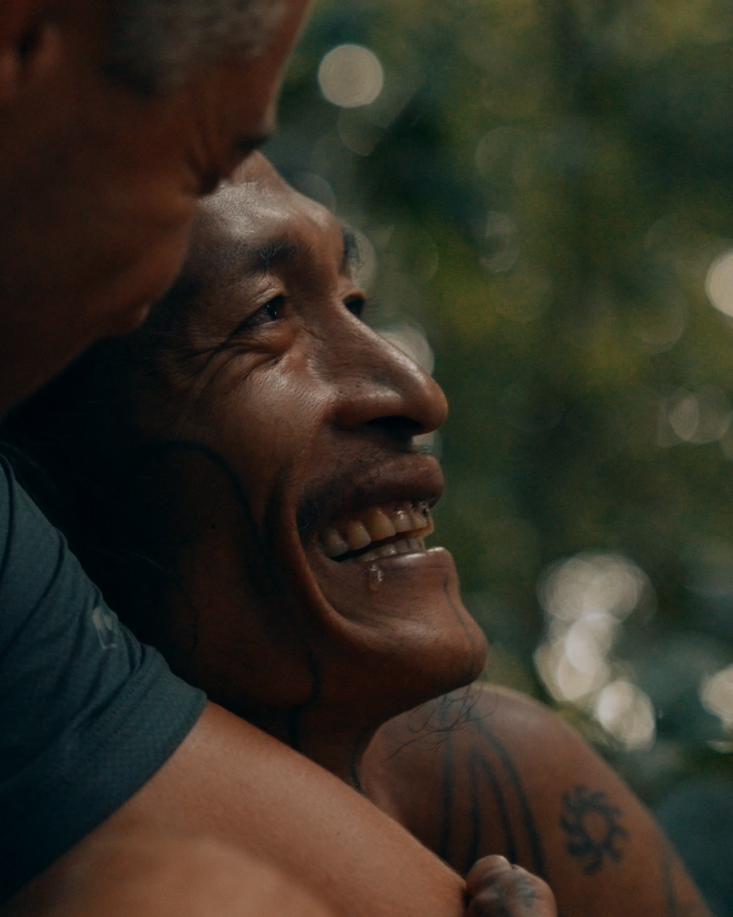 Blair laughing with a Mentawai tribe member