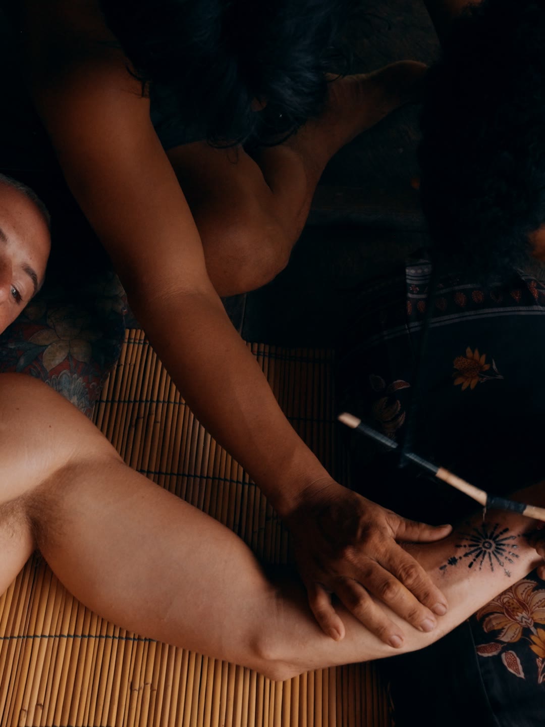 Blair receiving a traditional Mentawai tattoo